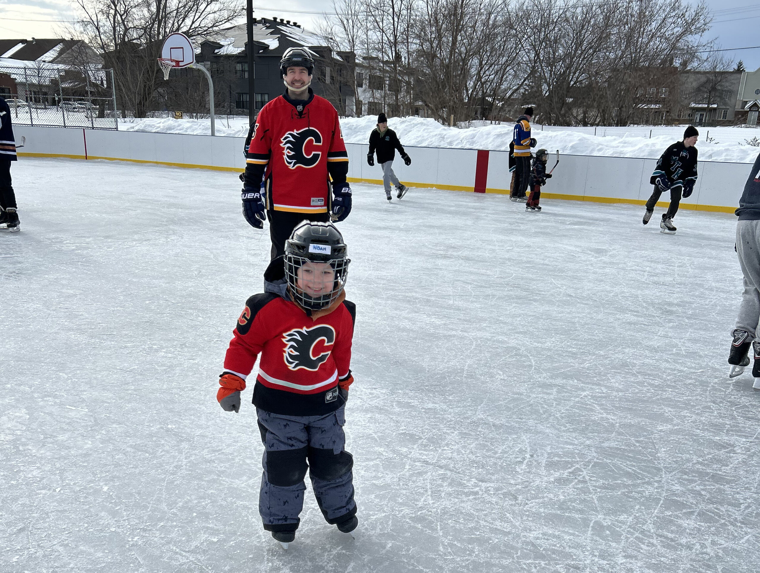 People skating on an outdoor rink